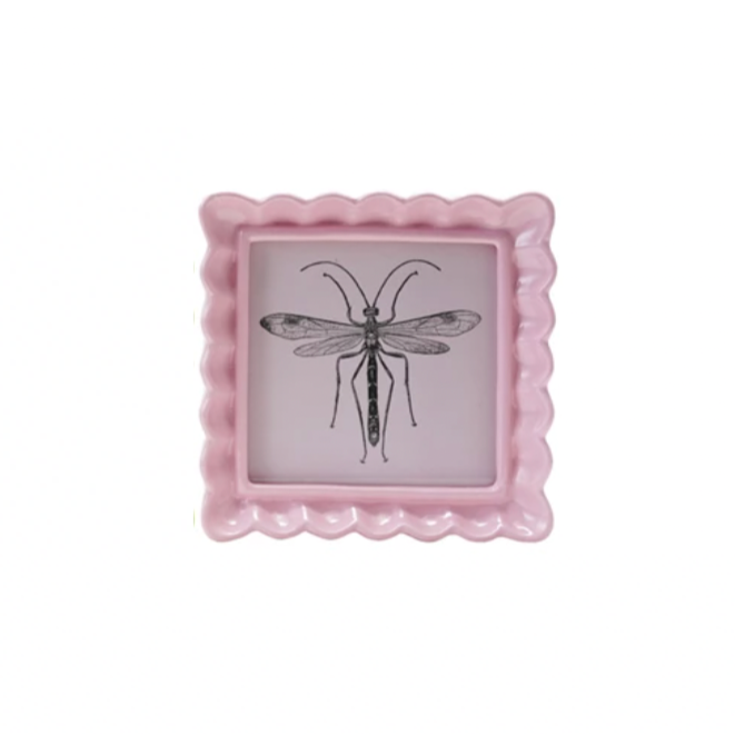 Display your memories with a twist in our Resin Wavy Photo Frame! Its unique design adds a playful touch to any space. Available in 4 fun colors, this frame is sure to make your photos pop! Perfect for those who love to add a little quirk to their decor. 5-1/4" Light Pink