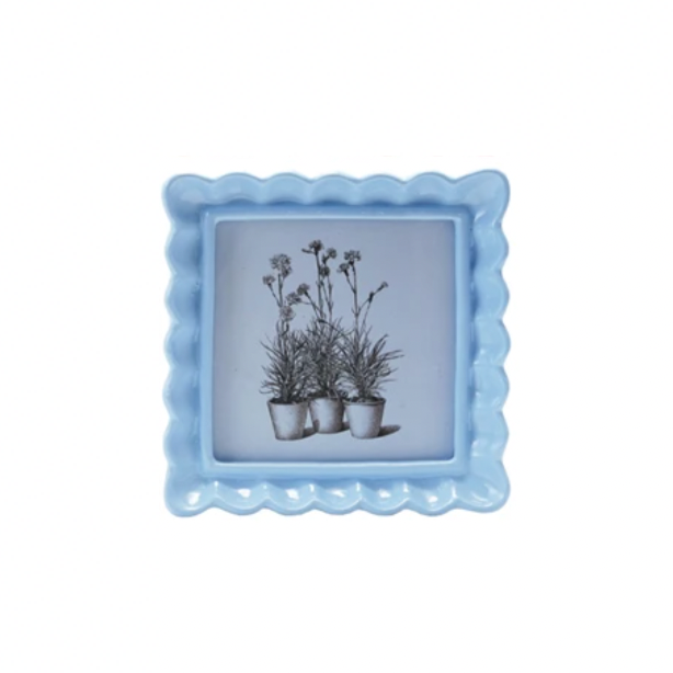Display your memories with a twist in our Resin Wavy Photo Frame! Its unique design adds a playful touch to any space. Available in 4 fun colors, this frame is sure to make your photos pop! Perfect for those who love to add a little quirk to their decor. 5-1/4" Blue