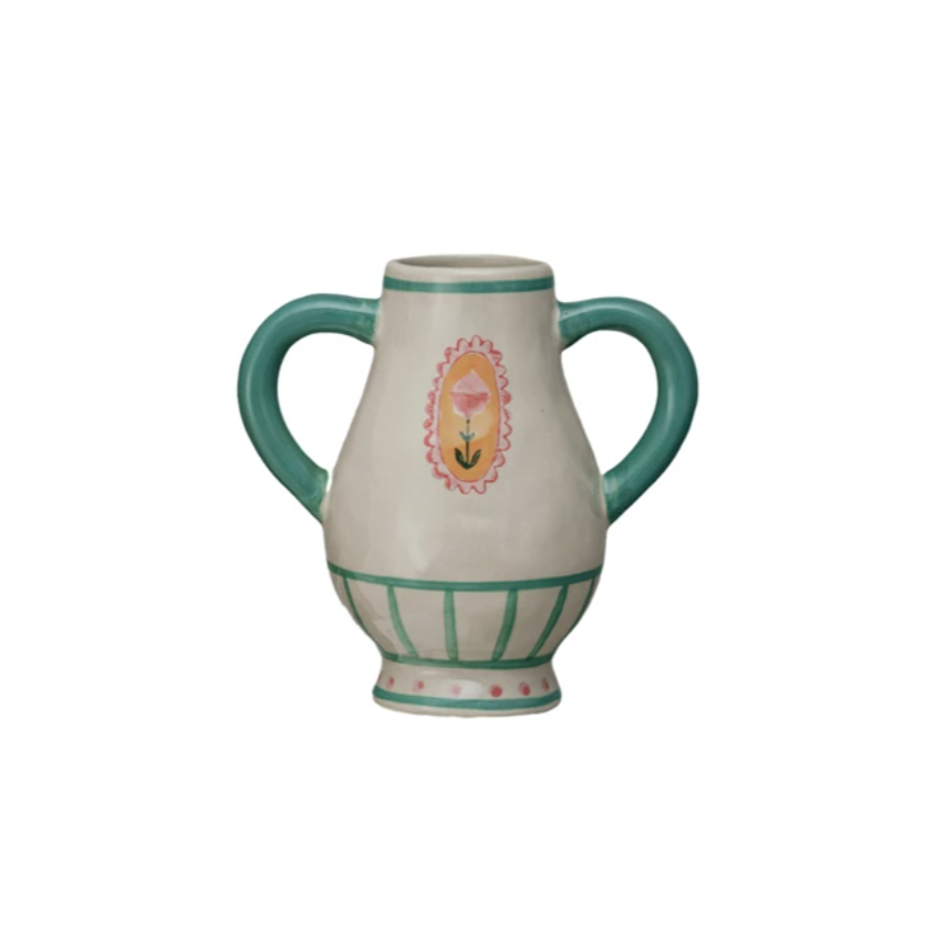 This Hand-Painted Stoneware Urn with Flower, Stripes, and Handles is a celebration of artistry and color. Its multi-colored palette includes a range of hues that complement its unique design. The urn's other shape sets it apart, offering a fresh take on traditional vases. Influenced by Scandinavian, Boho, and French Country styles, it serves as a versatile decor piece