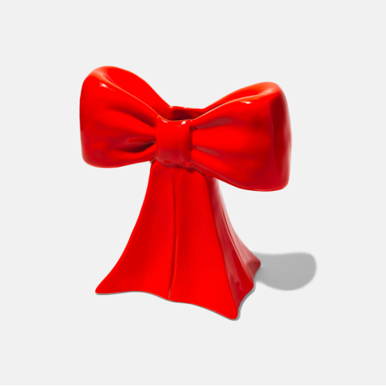 Ceramic vase shaped as a bow, taking inspiration from the ethereal ballet world and the whimsical allure of coquetry.