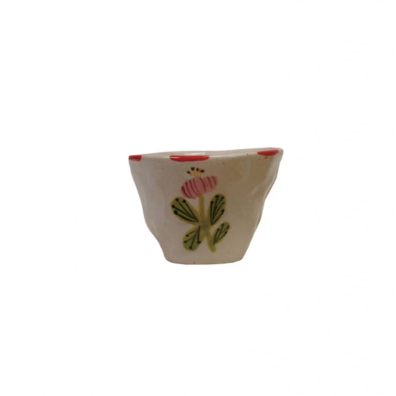 Add a pop of color to your day with this Hand-Painted Stoneware Cup/Bowl featuring a vibrant flower design! Perfect for sipping or snacking, its playful charm and unique artwork make every moment feel special. Brighten your kitchen and your mood with this cheerful, handcrafted piece! 3-1/4" Round x 2-1/2"H. 6 oz.