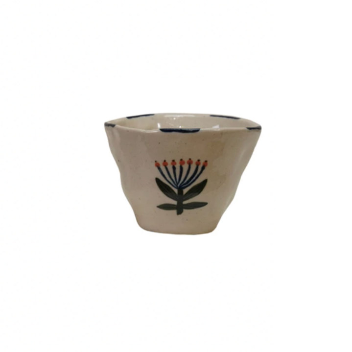 Add a pop of color to your day with this Hand-Painted Stoneware Cup/Bowl featuring a vibrant flower design! Perfect for sipping or snacking, its playful charm and unique artwork make every moment feel special. Brighten your kitchen and your mood with this cheerful, handcrafted piece! 3-1/4" Round x 2-1/2"H. 6 oz