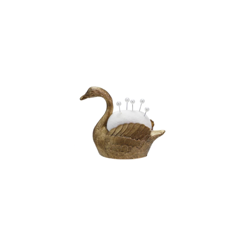 Add a touch of whimsy to your sewing kit with this Swan Velvet Pin Cushion! Soft velvet forms the charming snail shape, making it both adorable and practical. It comes with five pearl head pins, perfect for keeping your needles handy and stylish. Brighten up your crafting space with this playful and functional companion.&nbsp;Approximately 3"L