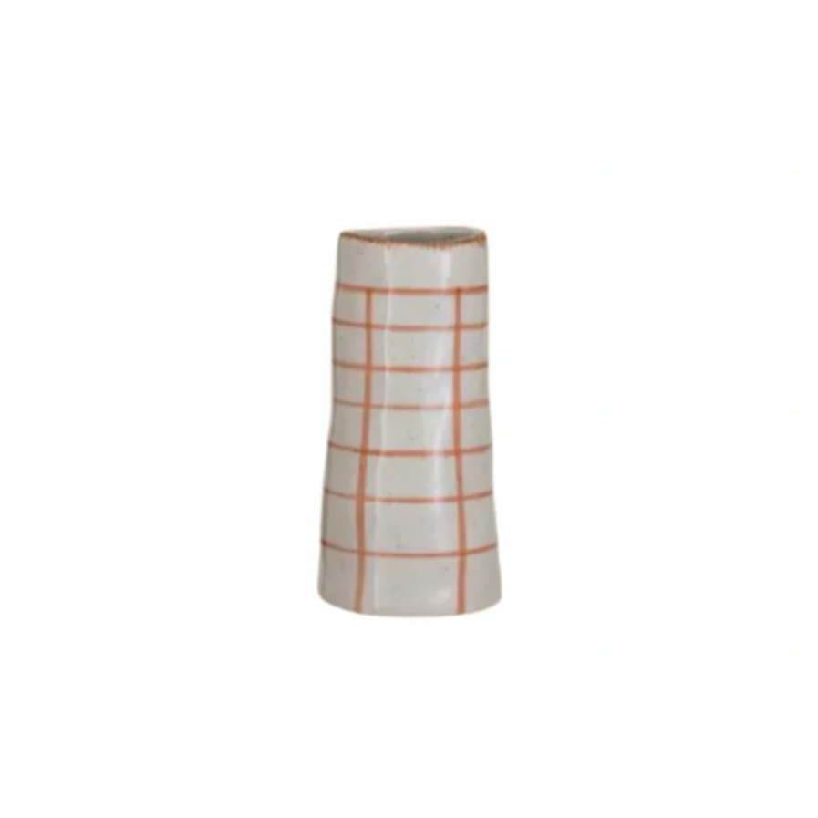 Cylindrical vase with grid pattern on a white background