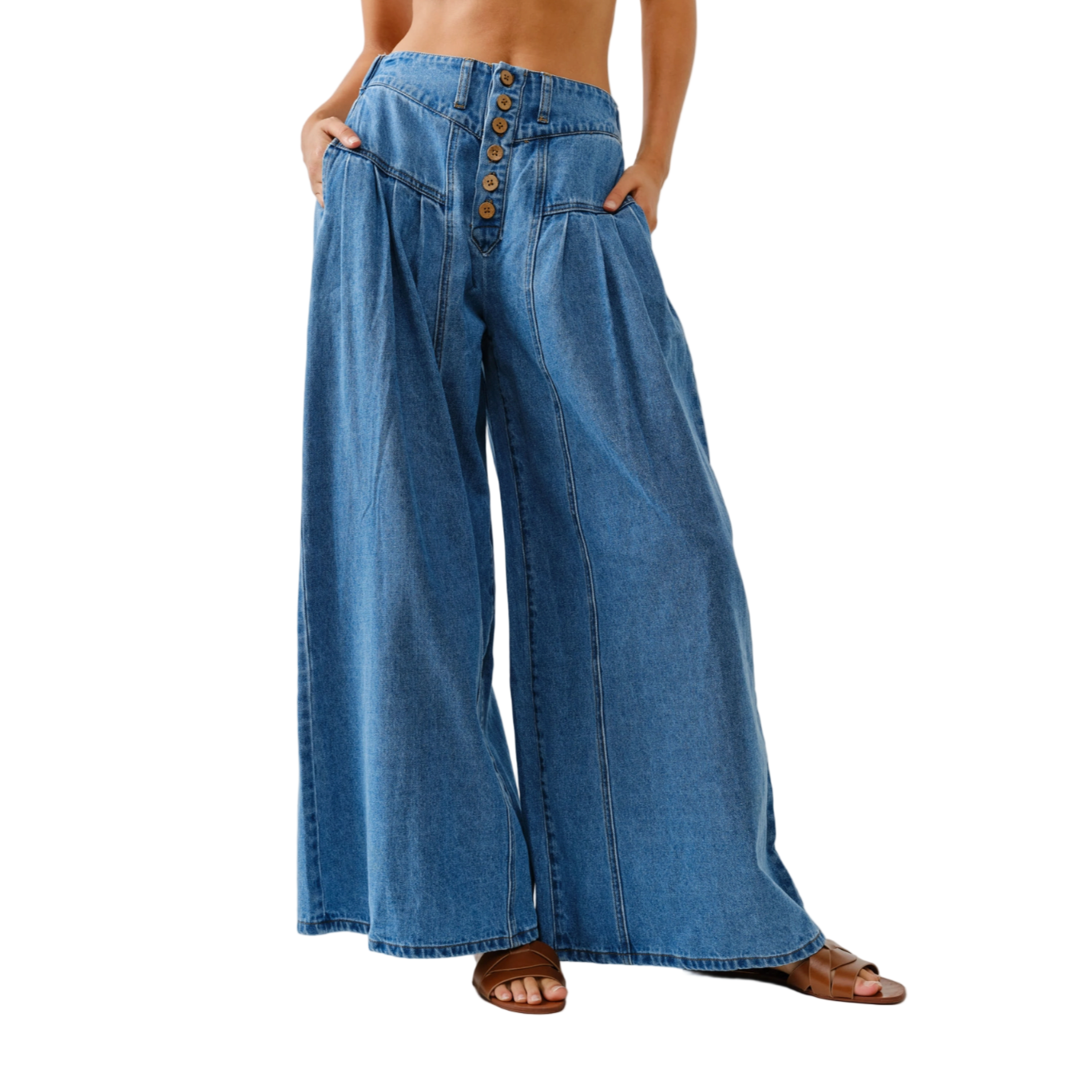 Wide-leg blue jeans with button details on a white background