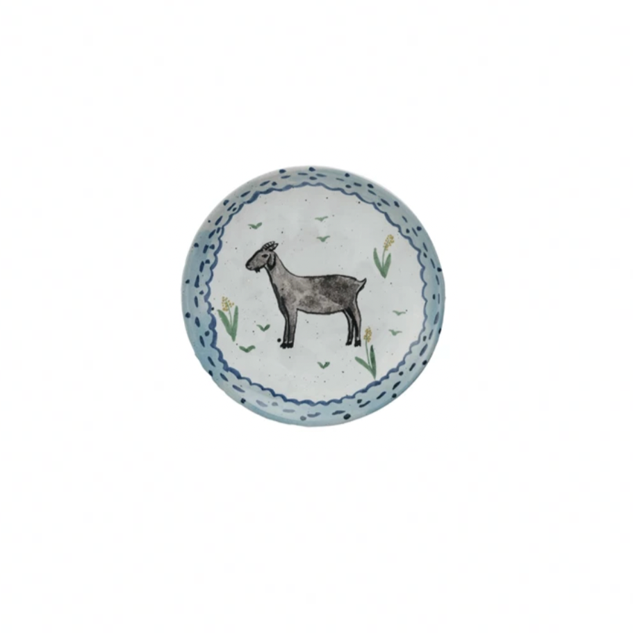 Round plate with a goat illustration on a white background