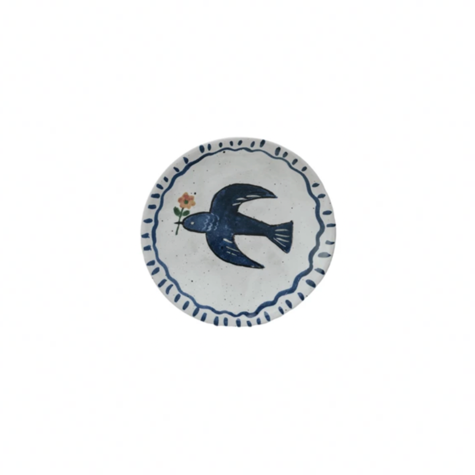 Round ceramic plate with a blue bird design on a white background