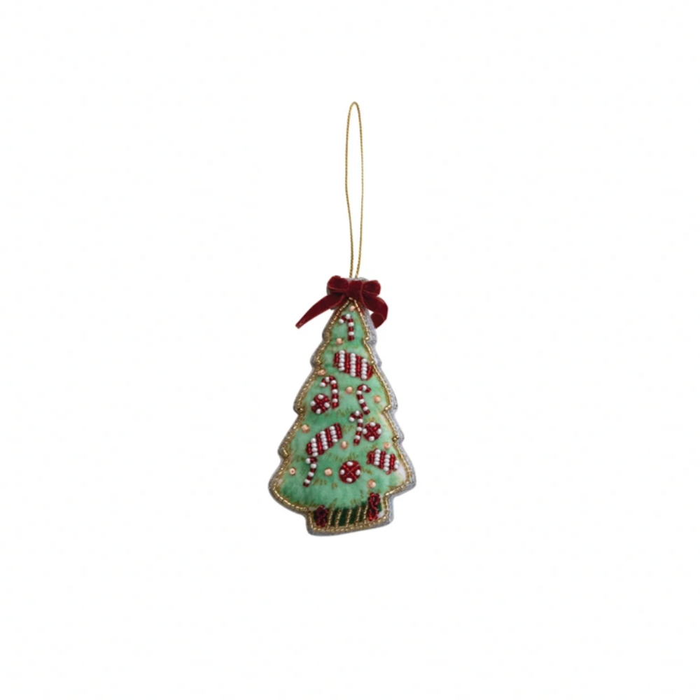 Decorative Christmas tree ornament with red berries on a white background