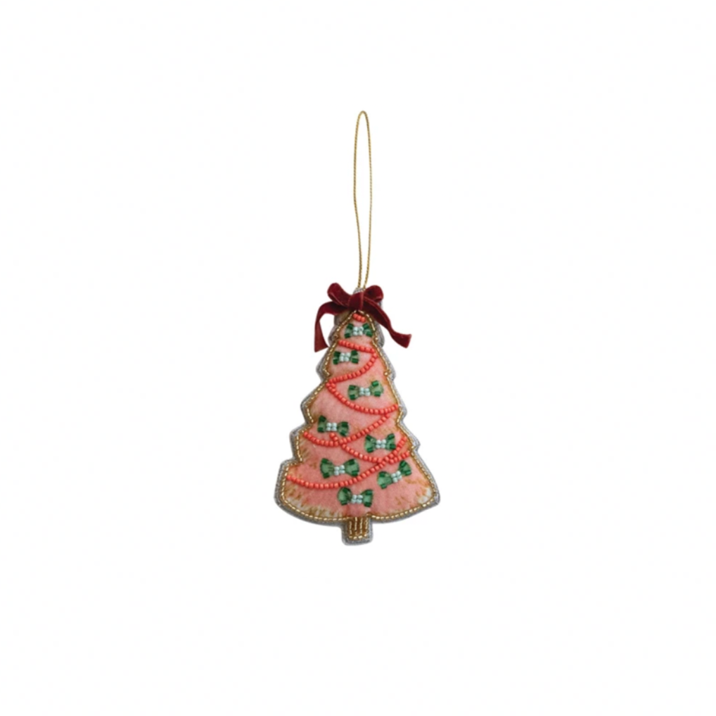 Decorative Christmas tree ornament with a pink base and green decorations on a white background