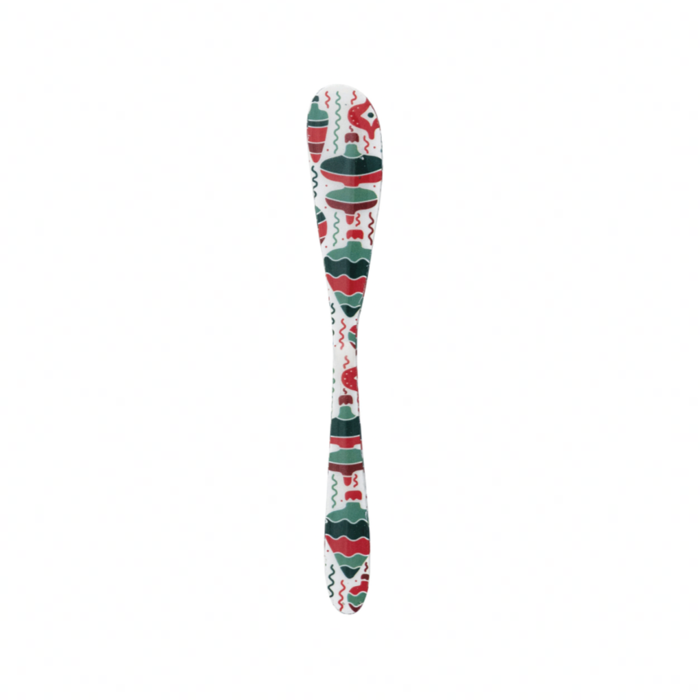Decorative spoon with a colorful pattern on a white background