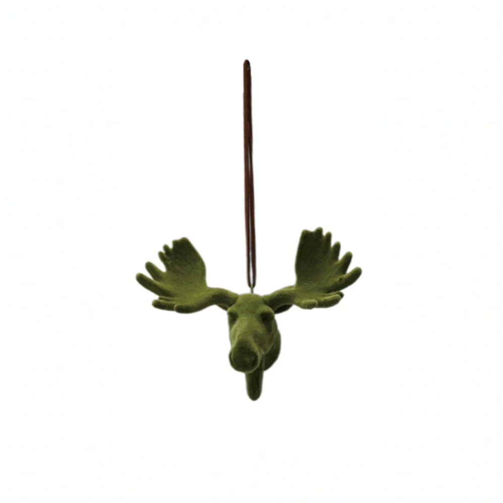 Green moose-shaped ornament on a white background