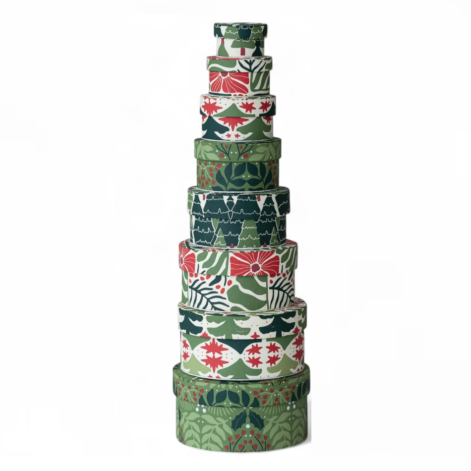 Stack of decorative boxes with various patterns on a white background