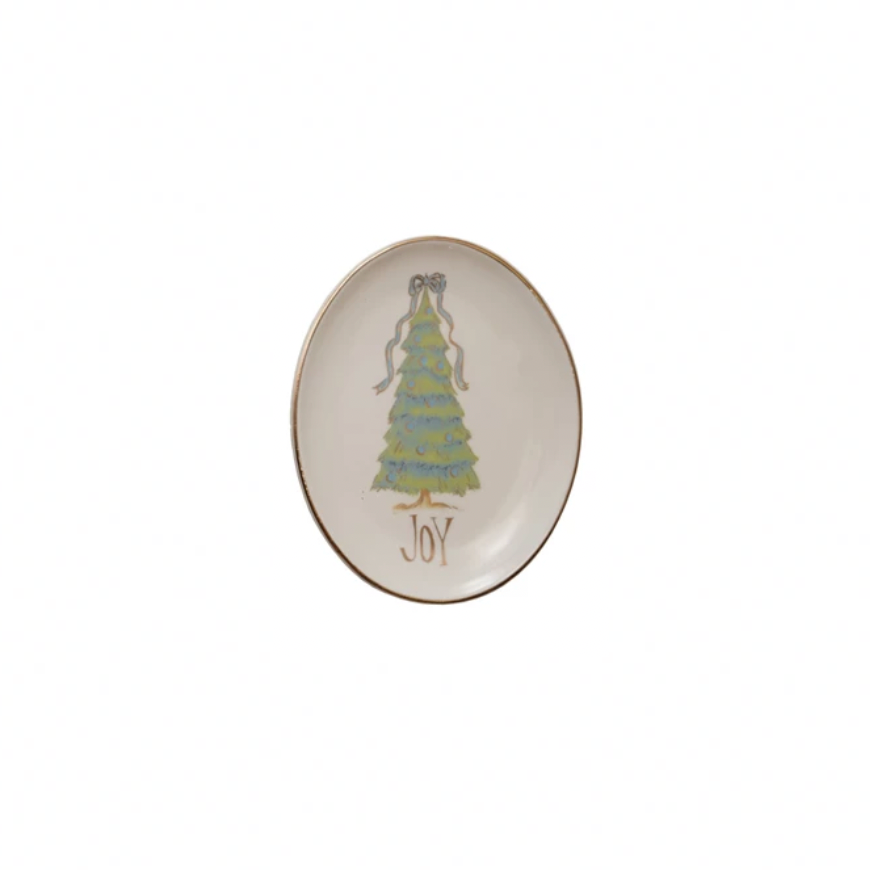 Decorative plate with a Christmas tree design and 'Joy' text on a white background