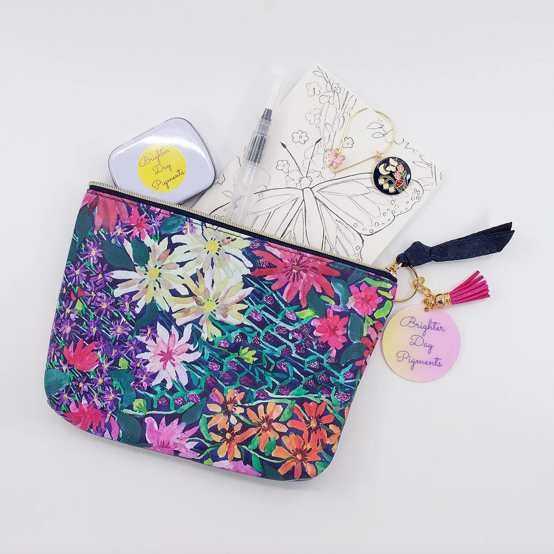 Floral pouch with decorative elements on a light gray background