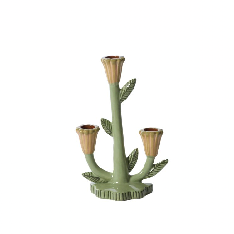Decorative candle holder with leaf design on a product page