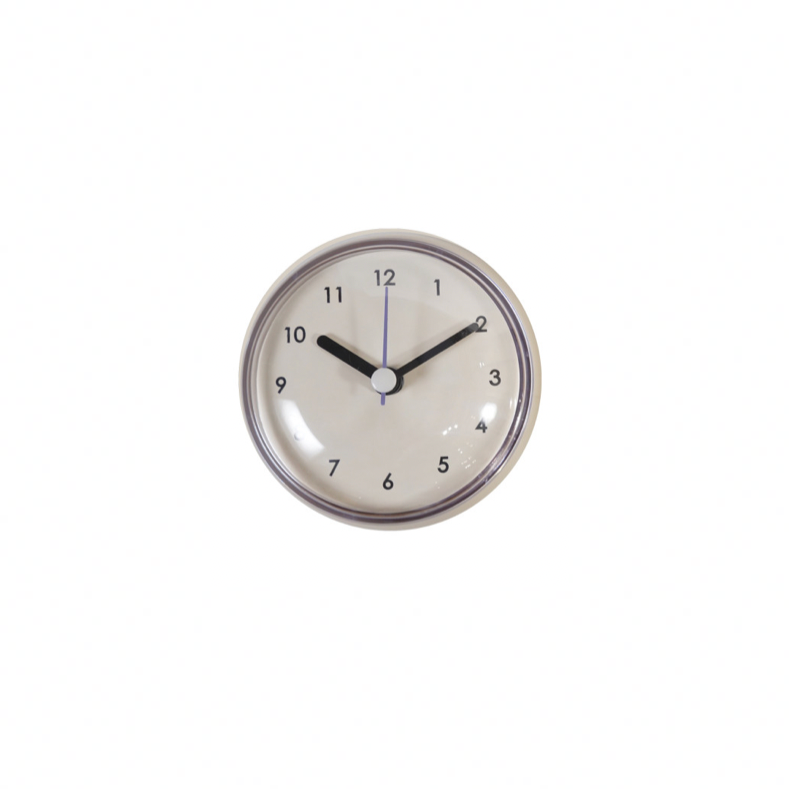 White Round wall clock with black hands on a white background. 