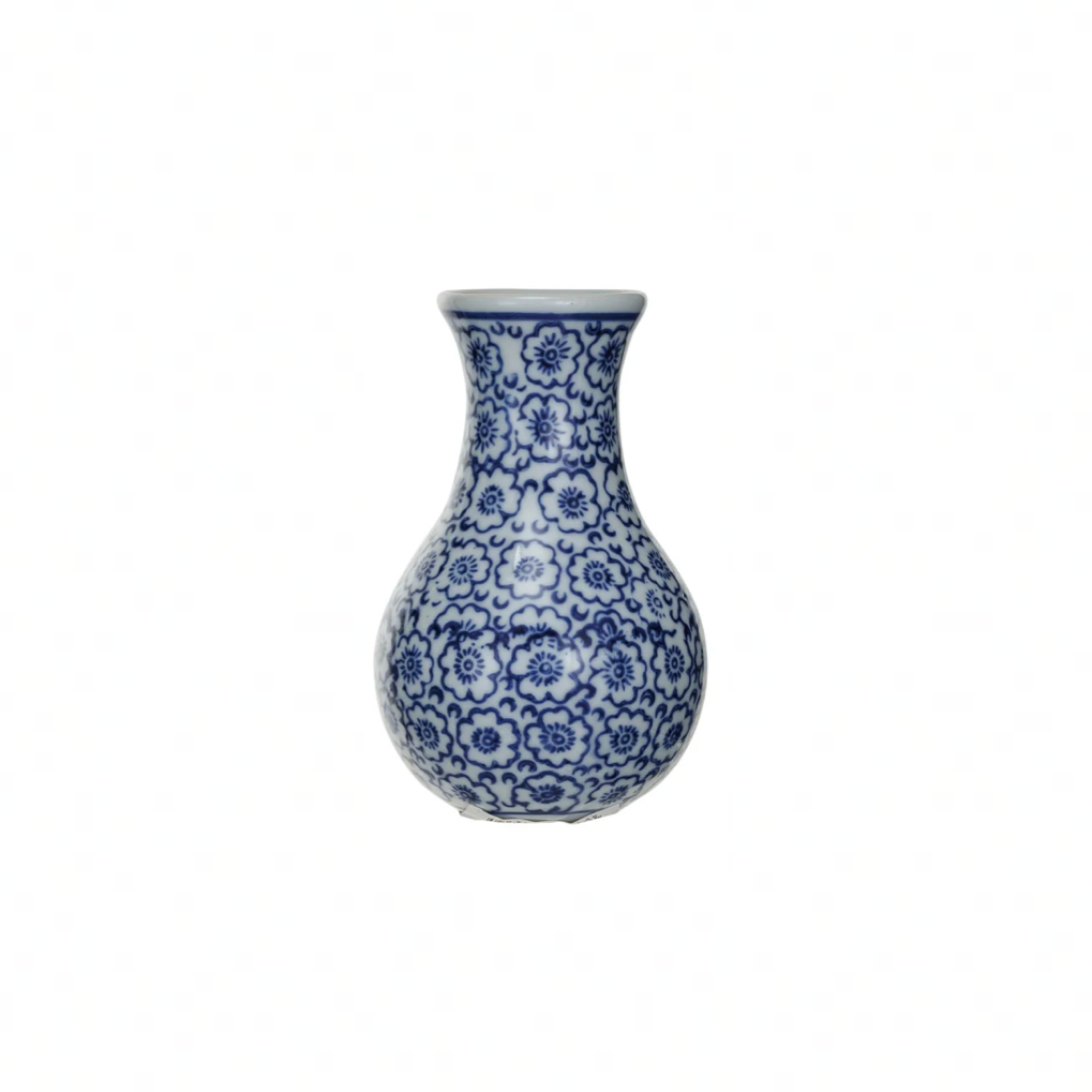 Ceramic vase with small blue floral patterns on a white background