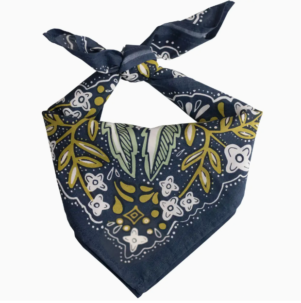 A navy blue bandana tie-on scarf with a white and olive green botanical pattern, displayed on a clean white background.