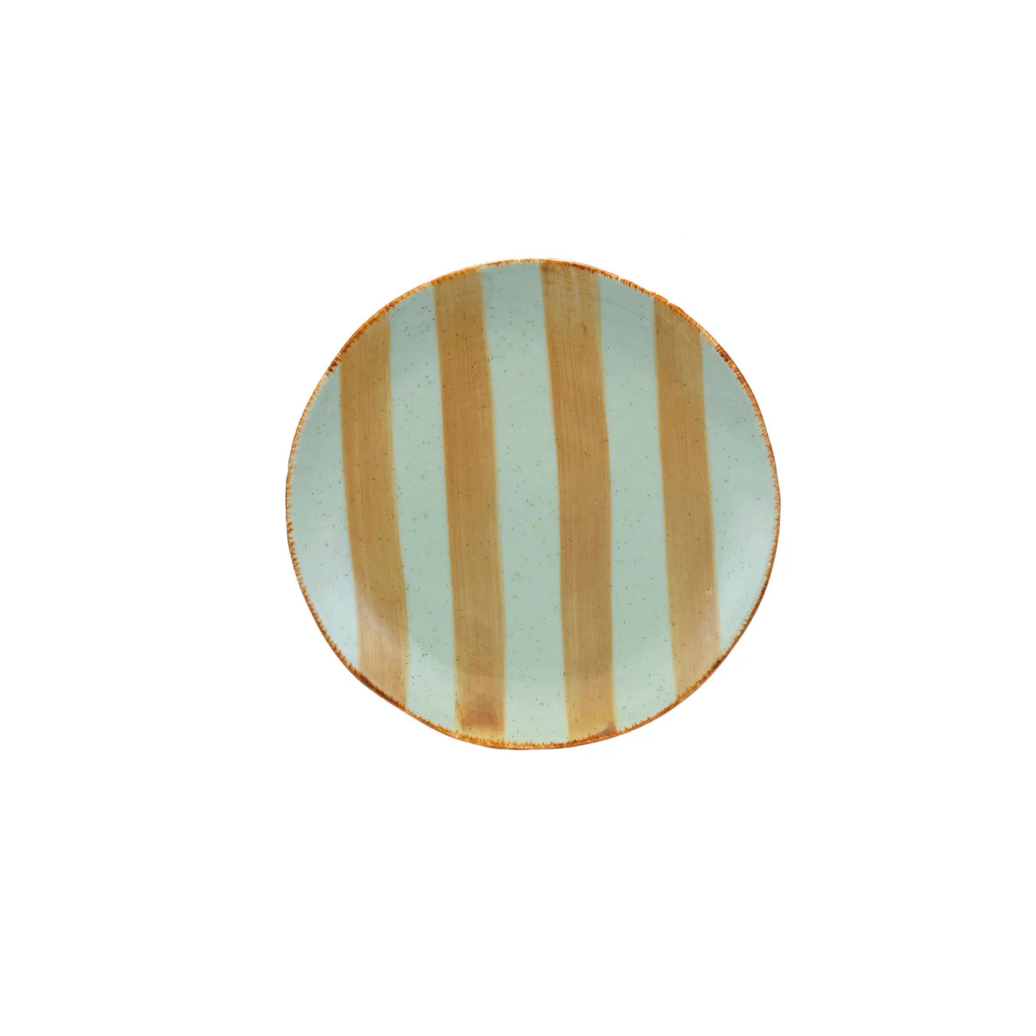 A round ceramic plate with vertical stripes in light blue and yellow stripe 