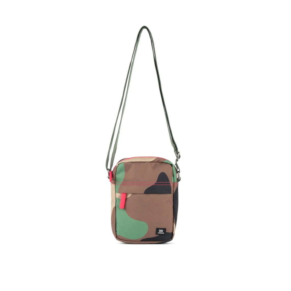 A small crossbody bag with a camouflage pattern in brown, green, and black, featuring a pink zipper pull and a black brand label on the front pocket, shown against a plain white background.