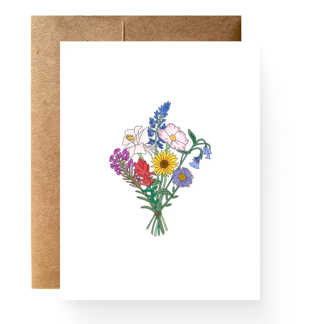 Long stemmed wildflowers grouped into a bouquet. 