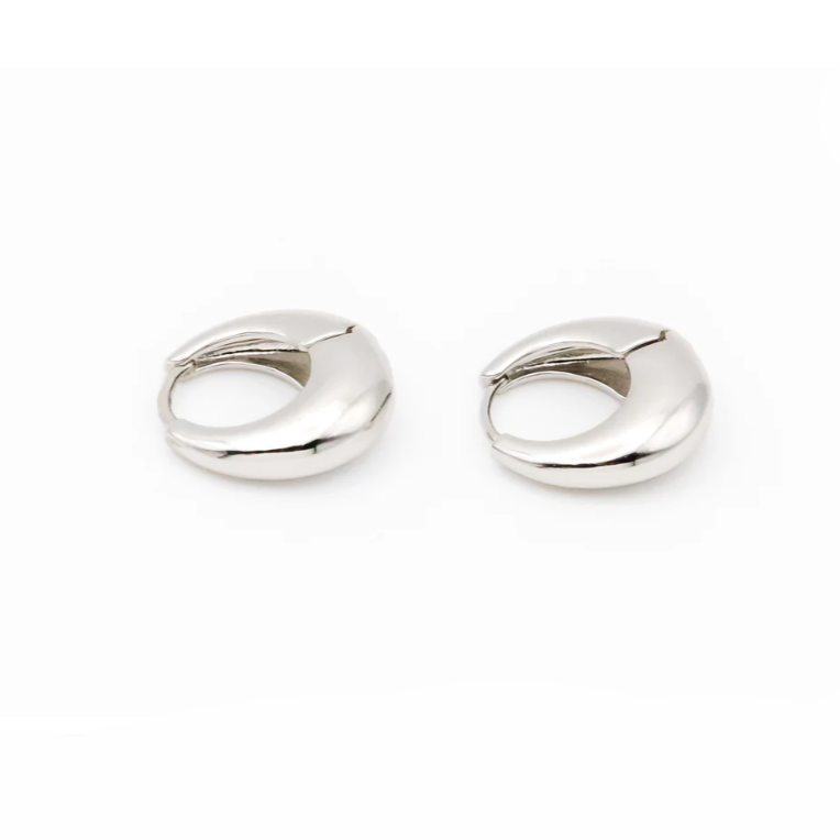 A pair of chunky silver hoop earrings with a smooth, polished finish are shown side by side against a white background. Their thick, rounded design gives them a bold yet minimalist look, perfect for everyday wear or dressing up an outfit.