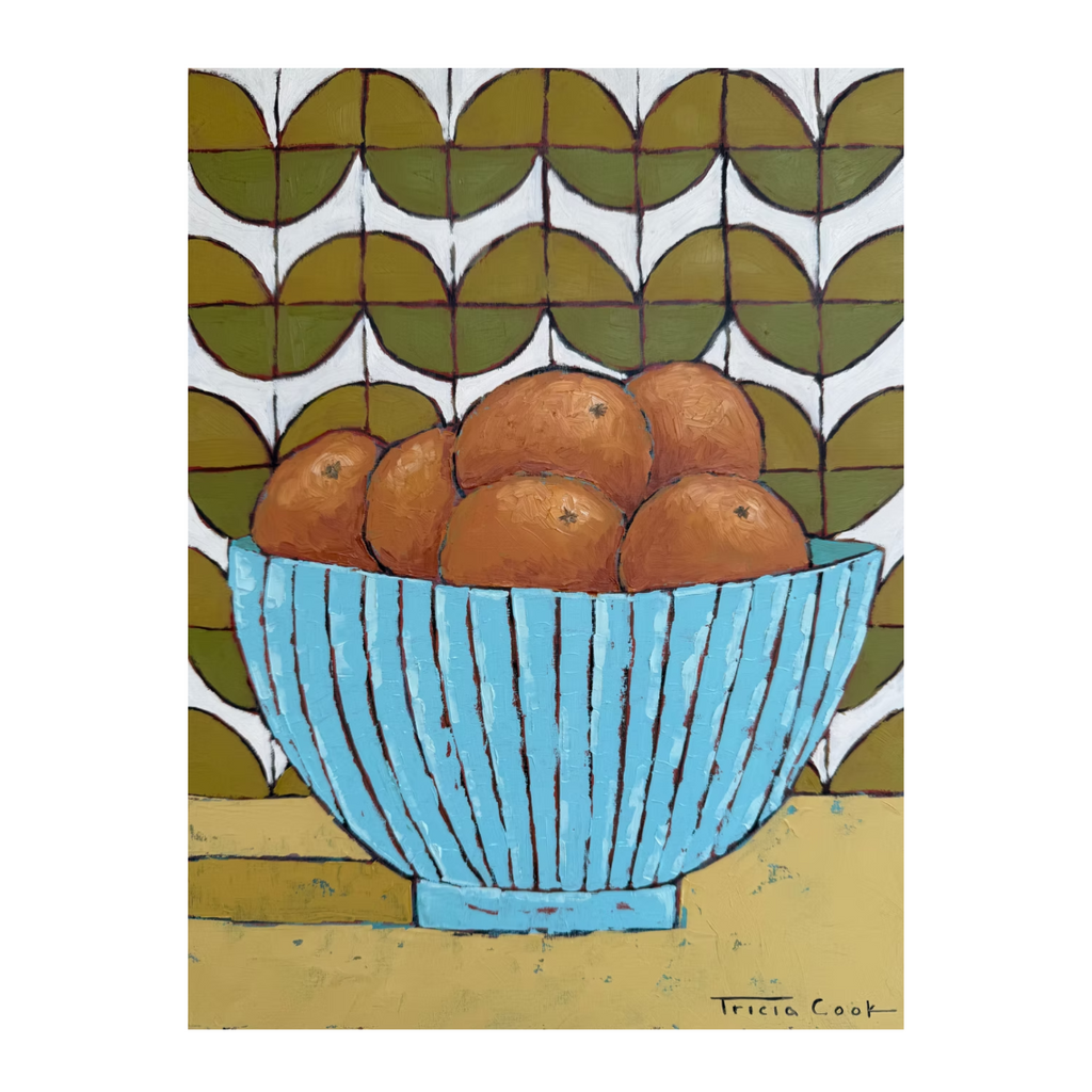 print featuring a blue bowl full of oranges sitting on a counter top with a green tile background