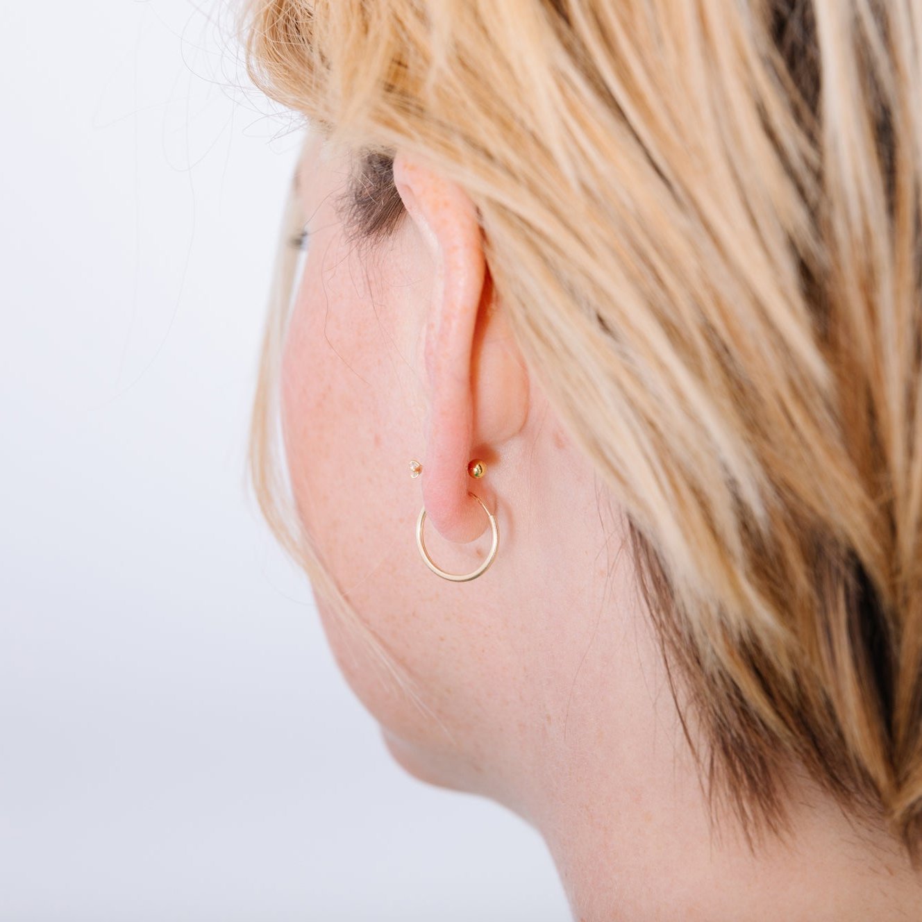 The unique post of a screw back earring screws into a tiny bead in the back of the ear. This tiny screw means no poking, no messing with, no losing earring backs.  The earring is completely secure and doesn't hurt your neck with its annoying pokes. Screw back earrings are comfortable to sleep in and just don't need to be messed with.  Nap all you want in these beauties!