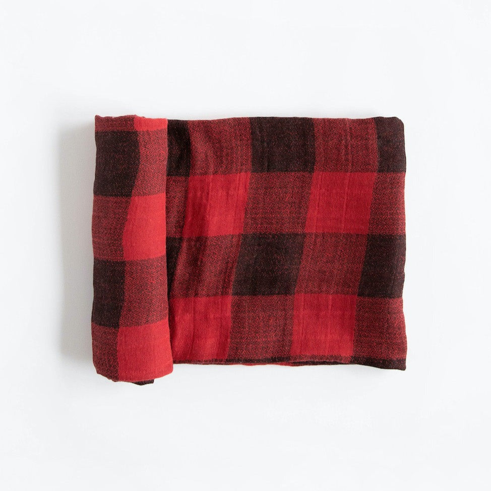 Featuring hand-painted prints, this versatile swaddle is an everyday essential. Crafted in lightweight and breathable cotton muslin, ideal for swaddling, nursing, cuddling and more. Cotton Muslin Swaddle Blanket - Red Plaid