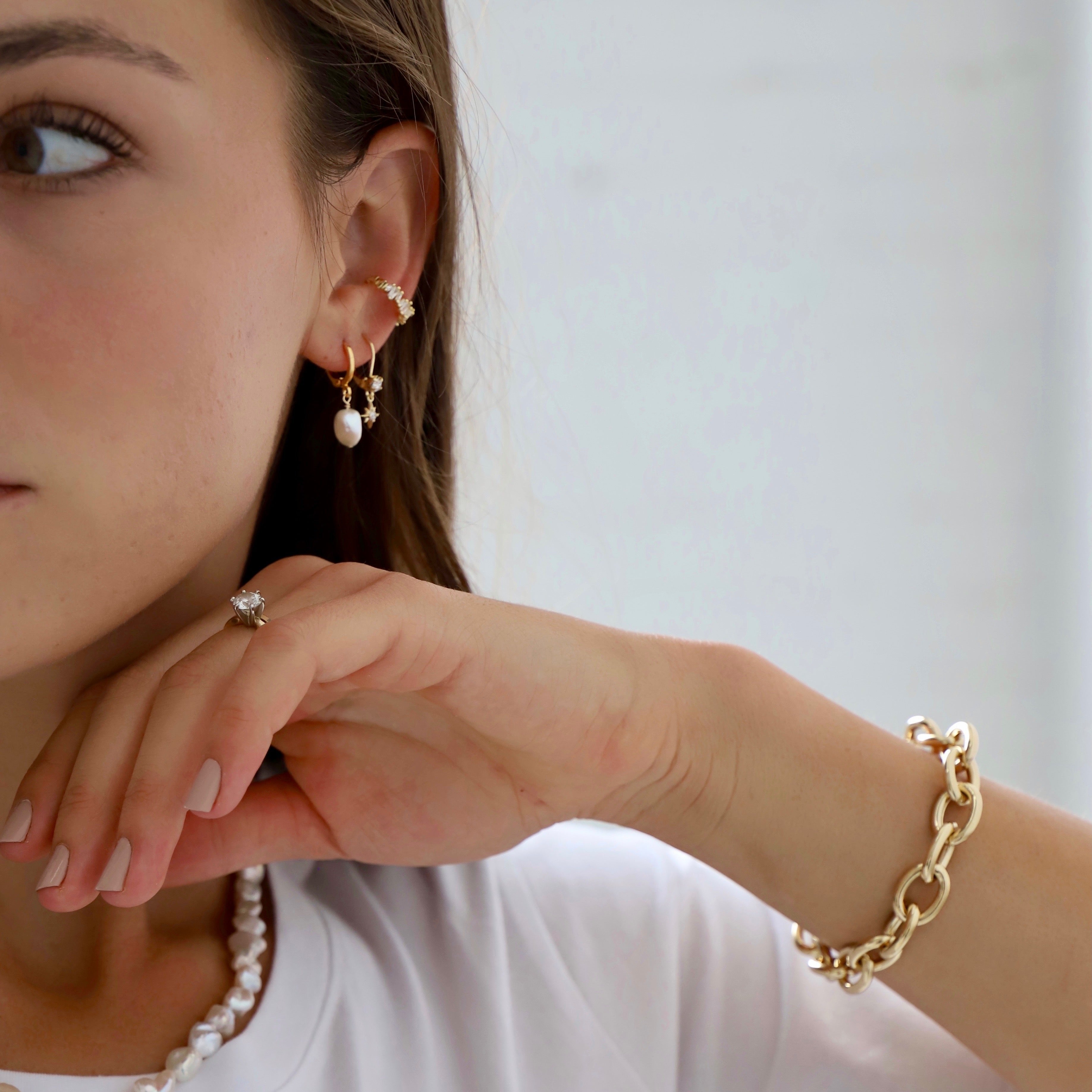 Our Keshi pearl nugget huggies put a classic spin on the pearl earrings your grandmother used to wear. With our organic looking keshi pearl, there is endless opportunity for different styling options!