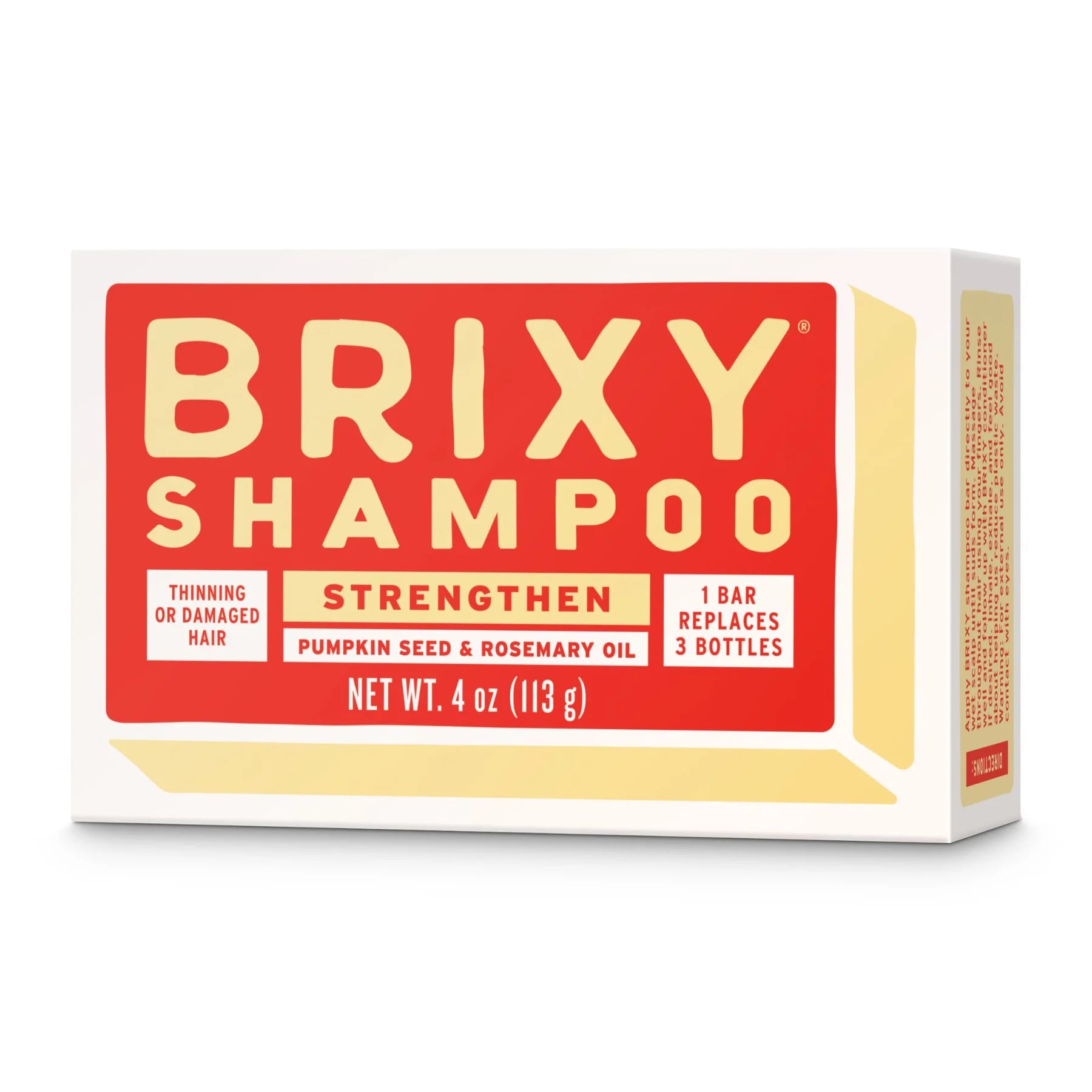 A rectangular box of BRIXY Shampoo in bold red and yellow packaging is labeled for strengthening thinning or damaged hair. The product contains pumpkin seed and rosemary oil  and promotes sustainability by replacing three bottles with one solid bar.