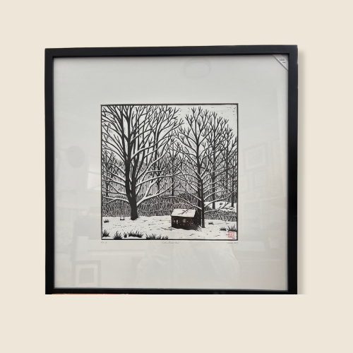 Size is 20.75 x 20.75, Linocut on paper, Black and White Print, Forest Scene in Winter, Large Bare Trees, Small Cabin