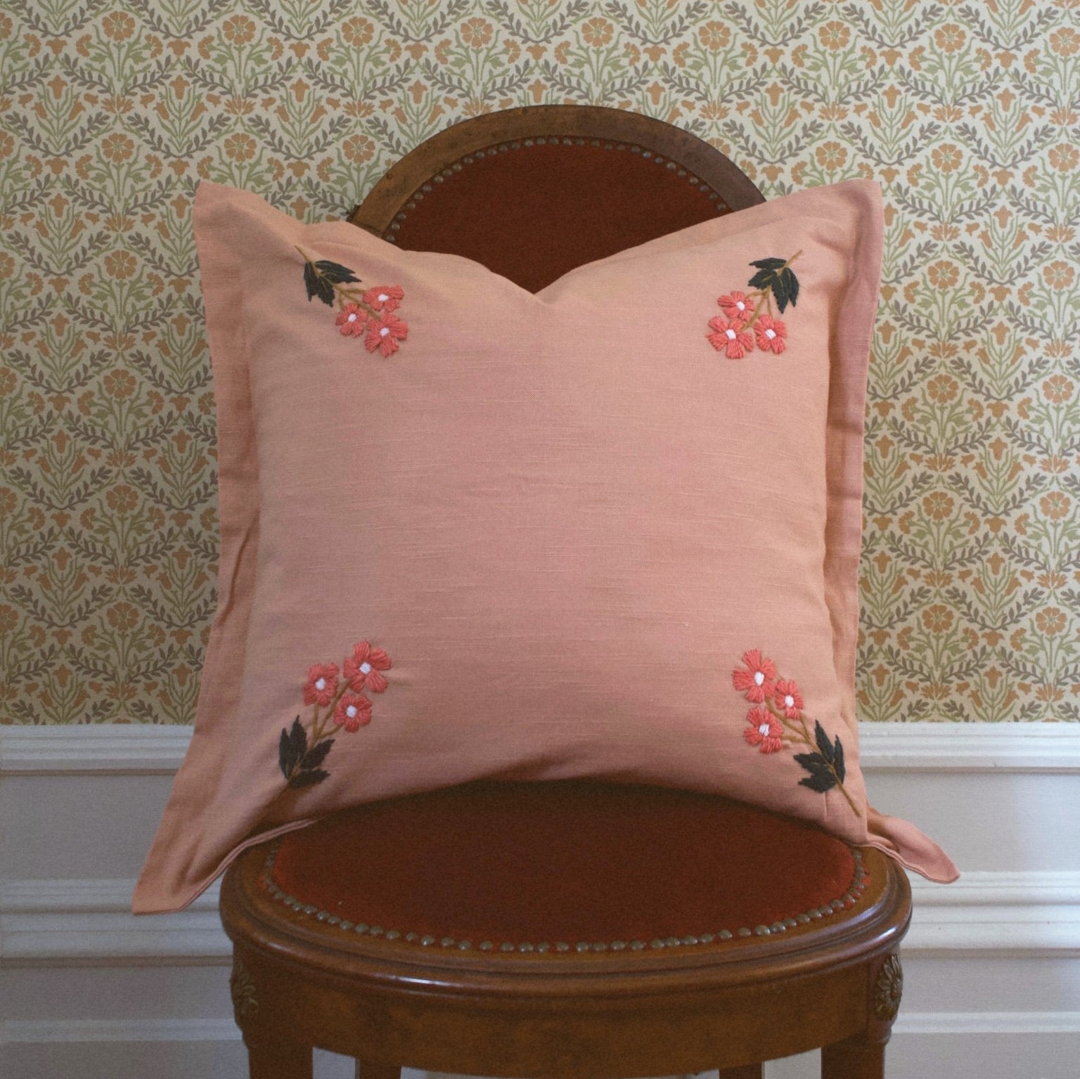 This beautiful, classic pattern features four embroidered flowers on our rose colored pillow. Our Ada Clare pillow features wool thread embroidery and each flower has been hand sewn to make this pillow truly one-of-a-kind.