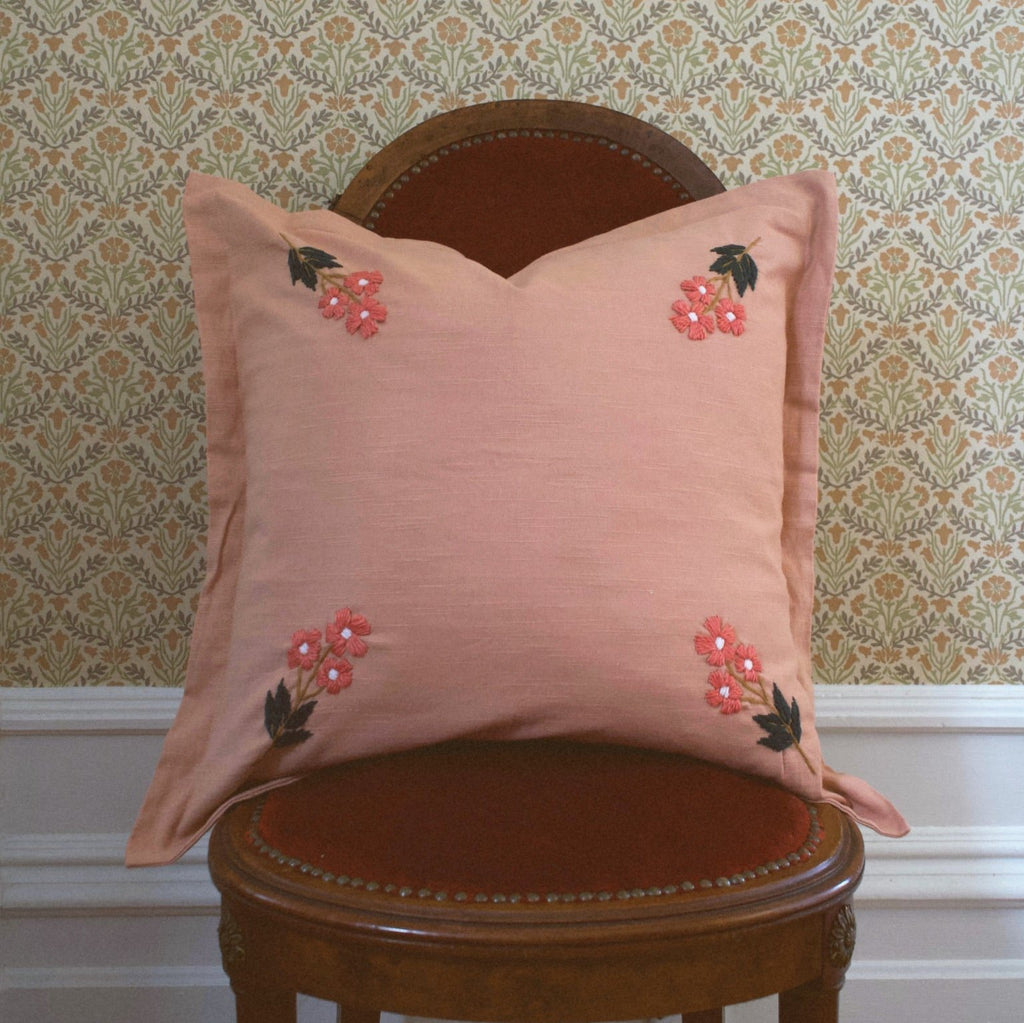 This beautiful, classic pattern features four embroidered flowers on our rose colored pillow. Our Ada Clare pillow features wool thread embroidery and each flower has been hand sewn to make this pillow truly one-of-a-kind.