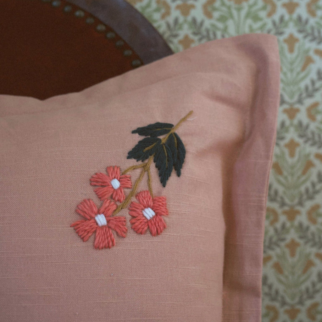 This beautiful, classic pattern features four embroidered flowers on our rose colored pillow. Our Ada Clare pillow features wool thread embroidery and each flower has been hand sewn to make this pillow truly one-of-a-kind.