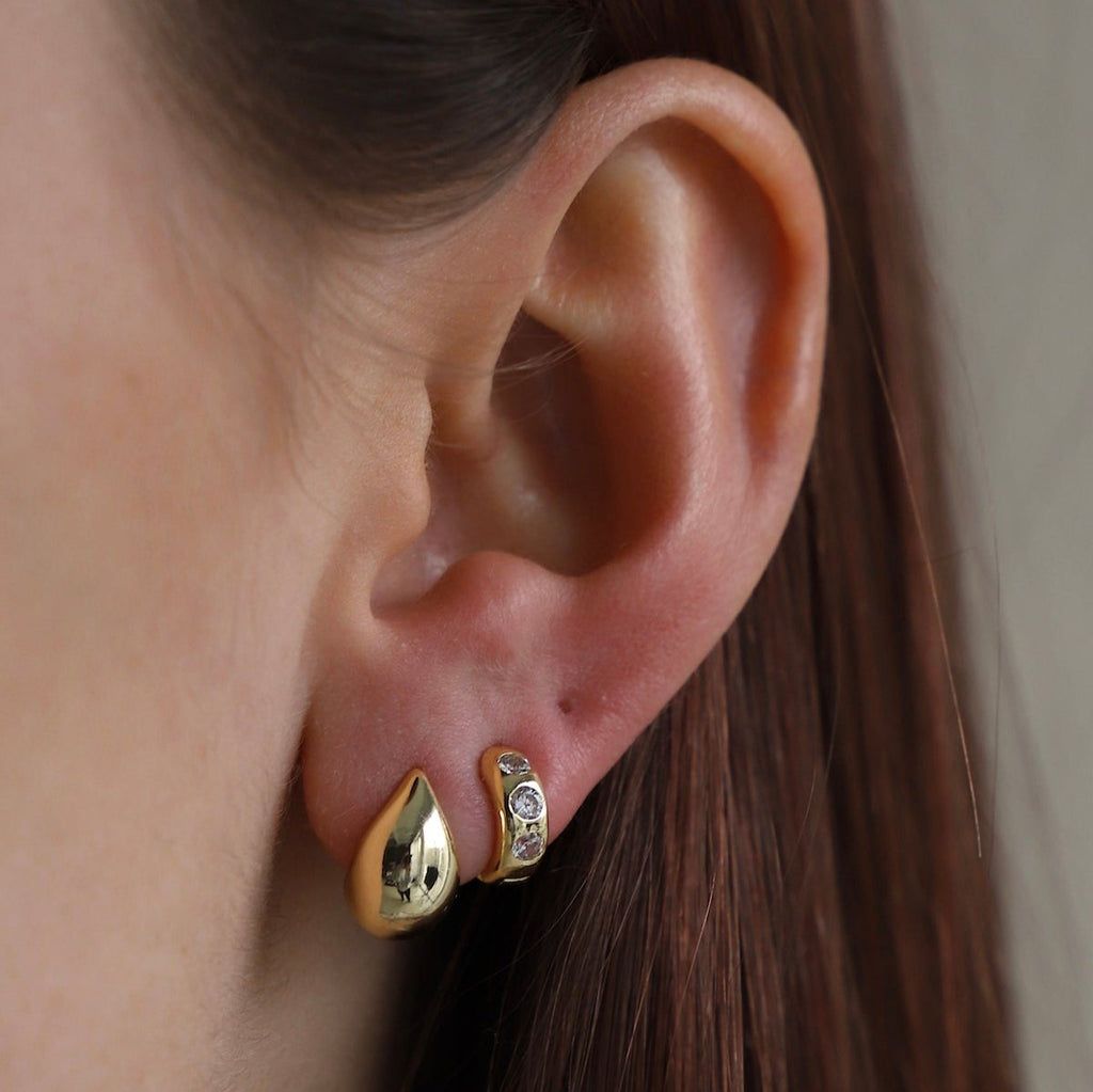 These mini dome stud earrings offer a chic and subtle touch of glam to any outfit. With their classic design and expert craftsmanship, these earrings are sure to become a staple in your jewelry collection.