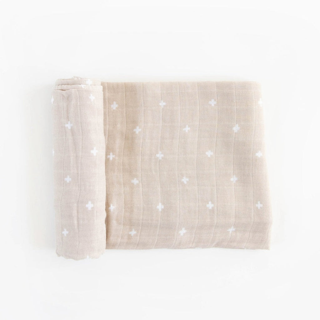 Featuring hand-painted prints, this versatile swaddle is an everyday essential. Crafted in lightweight and breathable cotton muslin, ideal for swaddling, nursing, cuddling and more. Cotton Muslin Swaddle Blanket - Taupe Cross.       Materials  100% cotton muslin.  Loose weave that breathes and keeps your little one the perfect temperature.