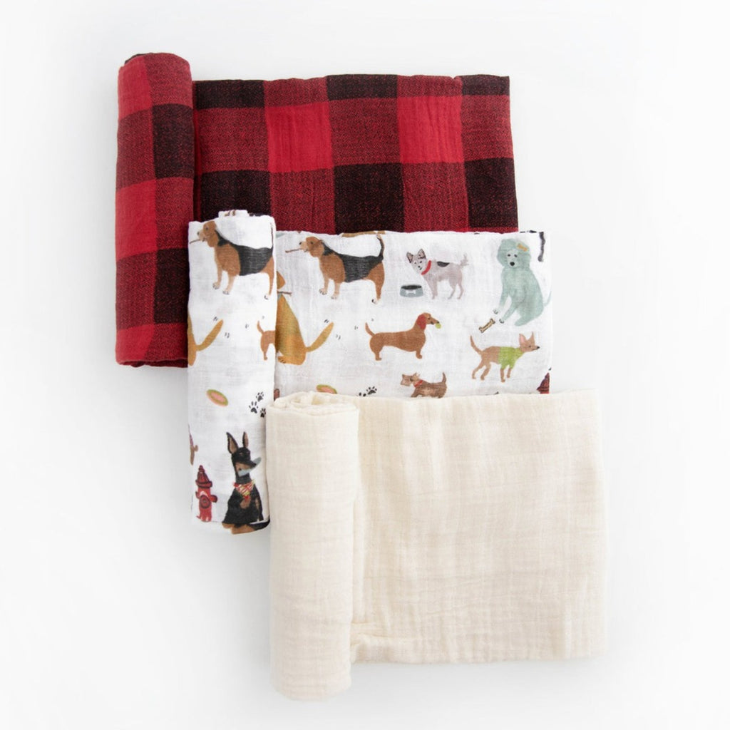 One to swaddle, one to cuddle, one to nurse! Featuring three hand-painted prints that fit your unique style, our swaddles are crafted in lightweight and breathable cotton muslin and get softer with every wash. Cotton Muslin Swaddle Blanket Set - Woof.      Materials  100% cotton muslin.  Loose weave that breathes and keeps your little one the perfect temperature.