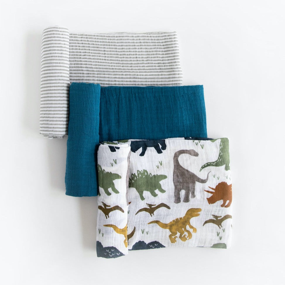 One to swaddle, one to cuddle, one to nurse! Featuring three hand-painted prints that fit your unique style, our swaddles are crafted in lightweight and breathable cotton muslin and get softer with every wash. Cotton Muslin Swaddle Blanket Set - Dino Friends 2.      Materials  100% cotton muslin.  Loose weave that breathes and keeps your little one the perfect temperature.