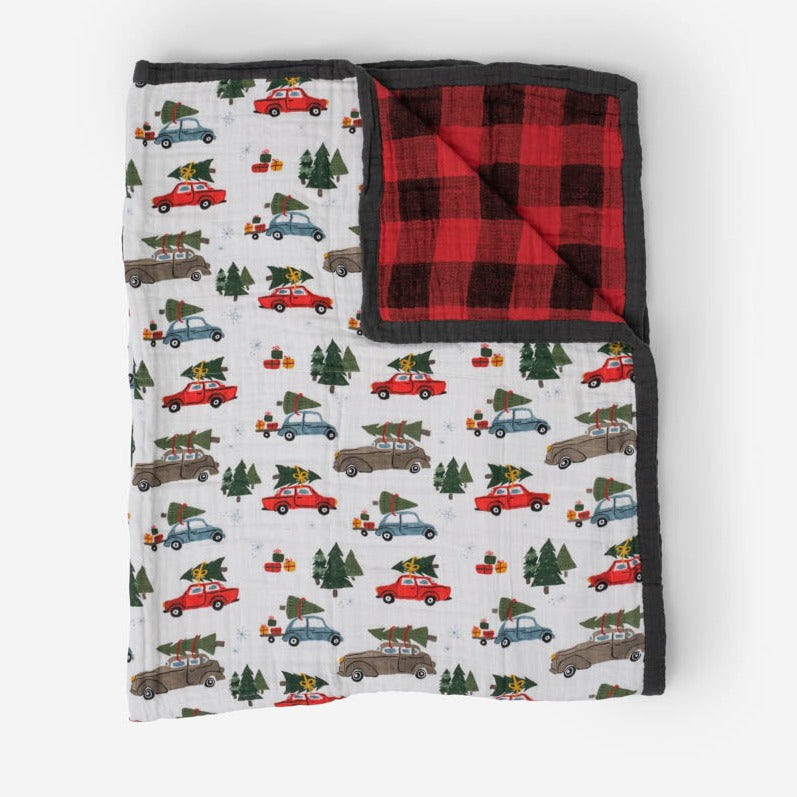 Classic quilt supersized! Made for nap time, playtime or anytime. Featuring four breathable layers that get softer with every wash, this versatile throw-sized quilt is an everyday essential. Cotton Muslin Quilted Throw - Holiday Haul