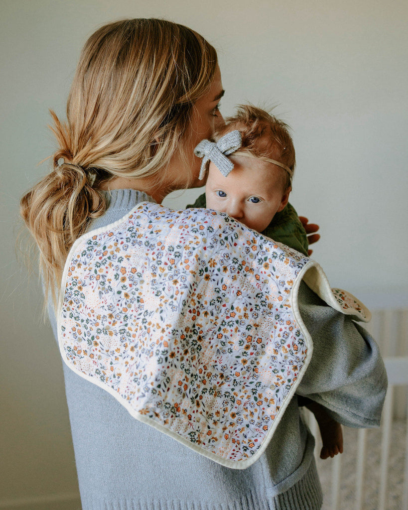 There's no use crying over spilled milk. With 4 absorbent layers of cotton muslin and an innovative shape, our burp cloth keeps you clean and dry while baby's snuggled tight.    Cotton Muslin Burp Cloth 2 Pack - Pressed Petals 