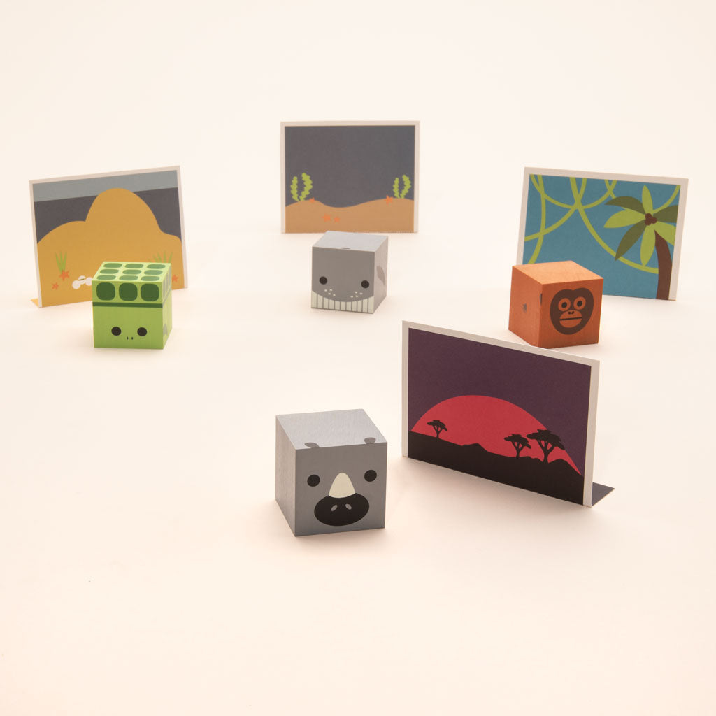 Humpback Whale. Orangutan. White Rhino. Sea Turtle. Made from sustainable Midwestern basswood.  You’ll also find four paper environments. Eco-friendly fun. Help our endangered species.  Mix, match, love.  4 - 1.75 inch cube