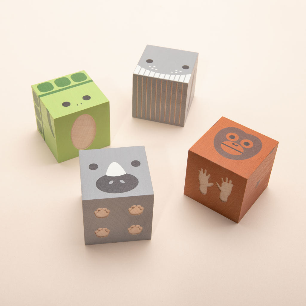 Humpback Whale. Orangutan. White Rhino. Sea Turtle. Made from sustainable Midwestern basswood.  You’ll also find four paper environments. Eco-friendly fun. Help our endangered species.  Mix, match, love.  4 - 1.75 inch cube