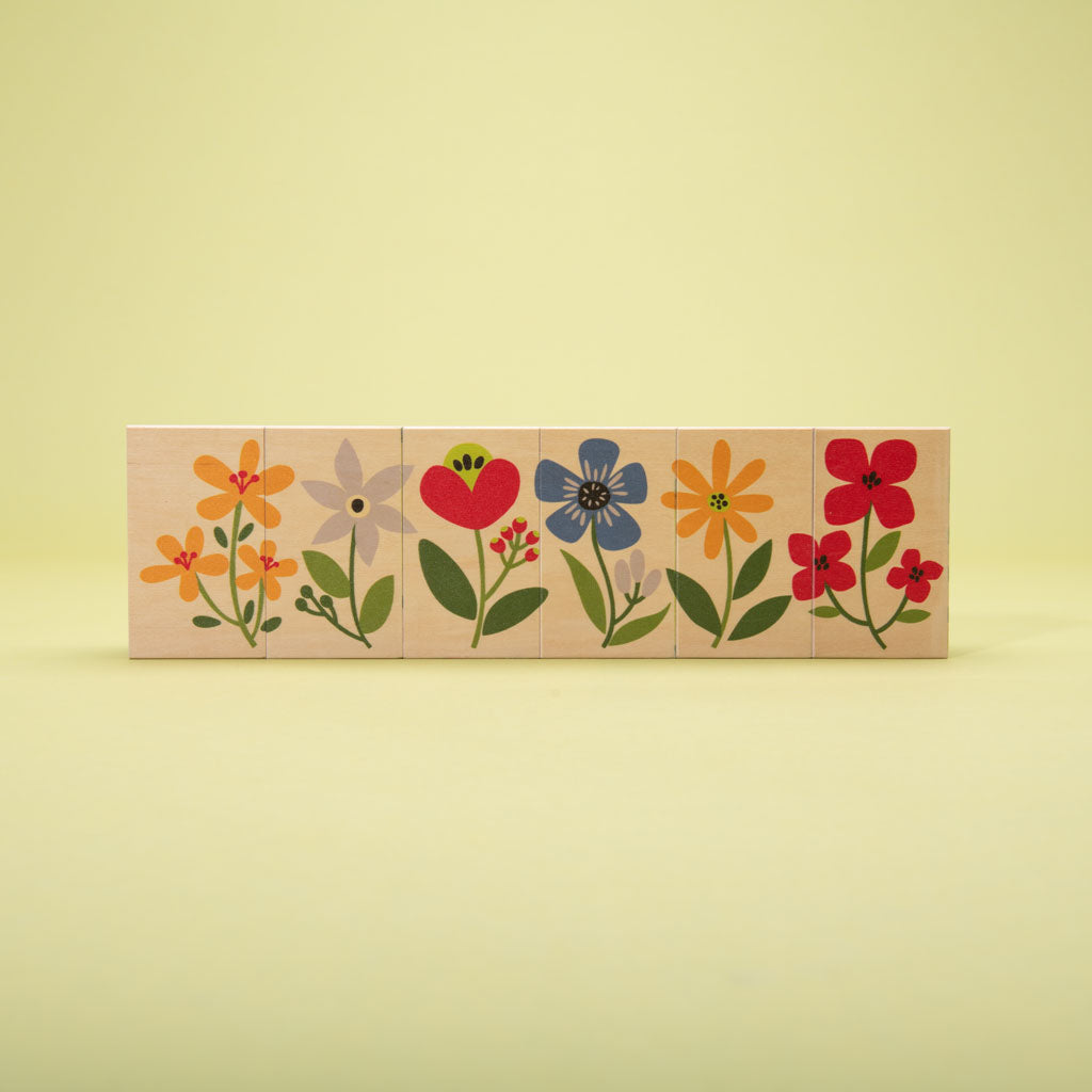 This floral frenzy is busting out with fun! Build your own garden scene. Six blocks feature tulips, colorful flowers, caterpillars, a butterfly, and more. Can you count the petals? How will you measure the inchworm with the ruler? More than colorful educational blocks, this artful set is a decorative puzzle, too. It’s blooming beautiful!  6 - 3 x 1.75 inch blocks