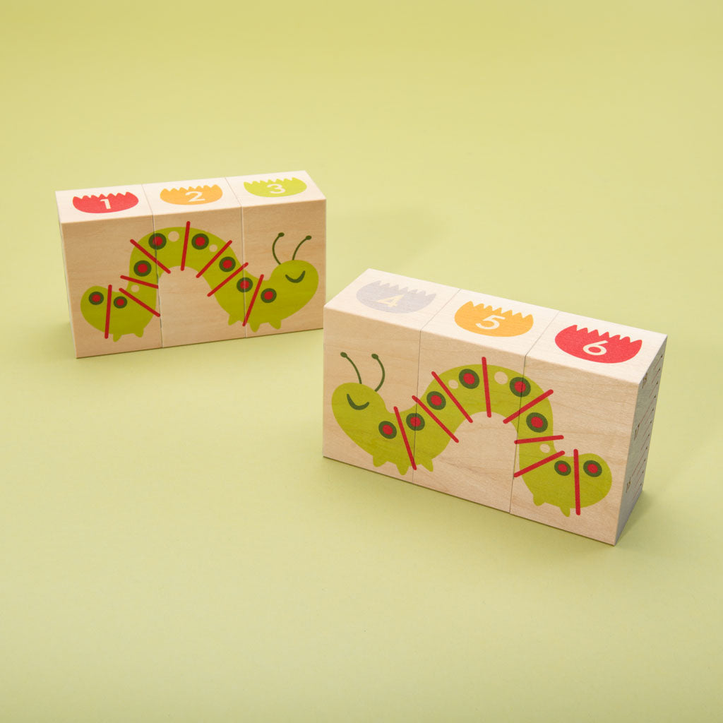 This floral frenzy is busting out with fun! Build your own garden scene. Six blocks feature tulips, colorful flowers, caterpillars, a butterfly, and more. Can you count the petals? How will you measure the inchworm with the ruler? More than colorful educational blocks, this artful set is a decorative puzzle, too. It’s blooming beautiful!  6 - 3 x 1.75 inch blocks