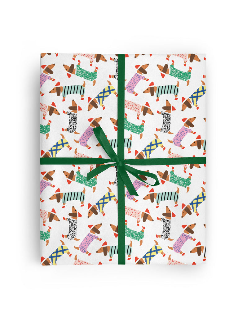 Nothing says winter wonderland like some cute little doxies!   Mid-weight gift wrap with matte finish.   Size  3 Single sheets gift wrap per roll 19.7" x 27.5" per sheet