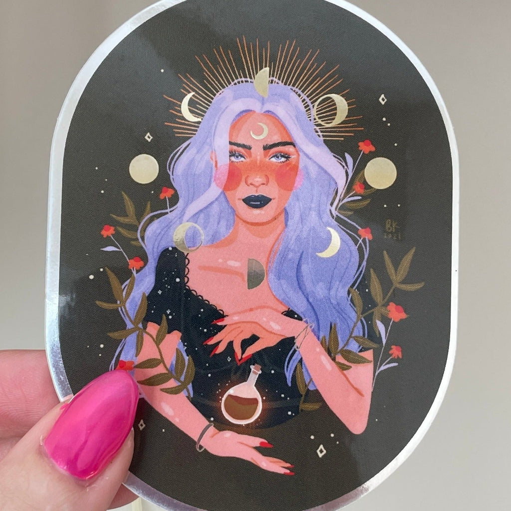 Witchy Sticker with mirrored foil effects. The witch has wavy, silver hair and is levitating a potion bottle between her hands. 
