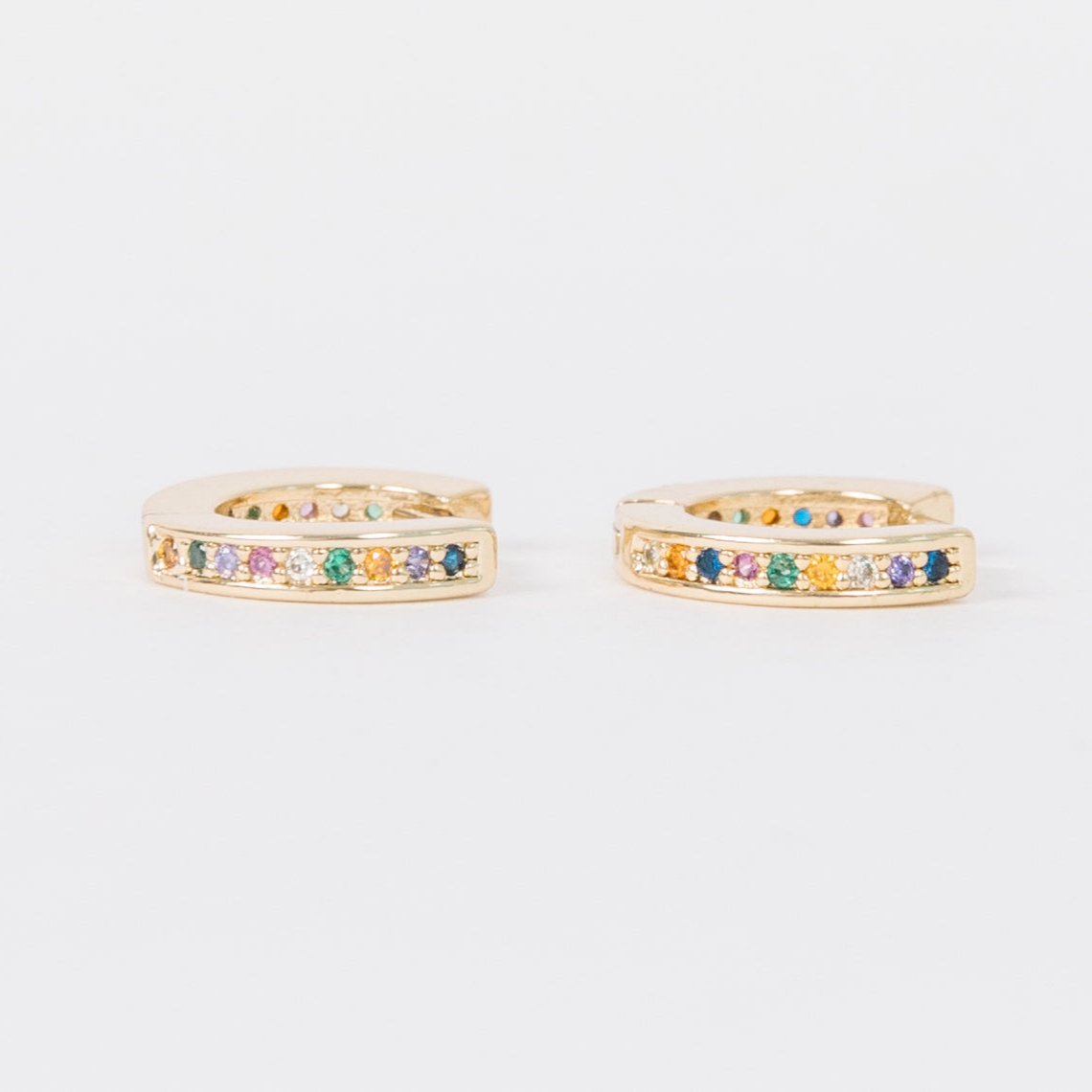 14k Gold Filled 12 mm huggie clasp Safe for sensitive skin Unique clasp has no post when earrings are closed, allowing for comfortable wear and sleep without having to remove earrings Multicolored bejeweld stones&nbsp;are 2 mm Perfect for mulitple piercings Freaking cute and freaking tiny