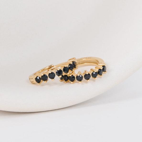 Classy + sleek, these black diamond huggies are ready for the slopes or your next black tie event. Their unique click-in-click-out clasp allows you to leave them in day and night without any discomfort. Sleep in these? Check. Shower in these? Check. DO YOUR LIVING IN THESE? Check check check.