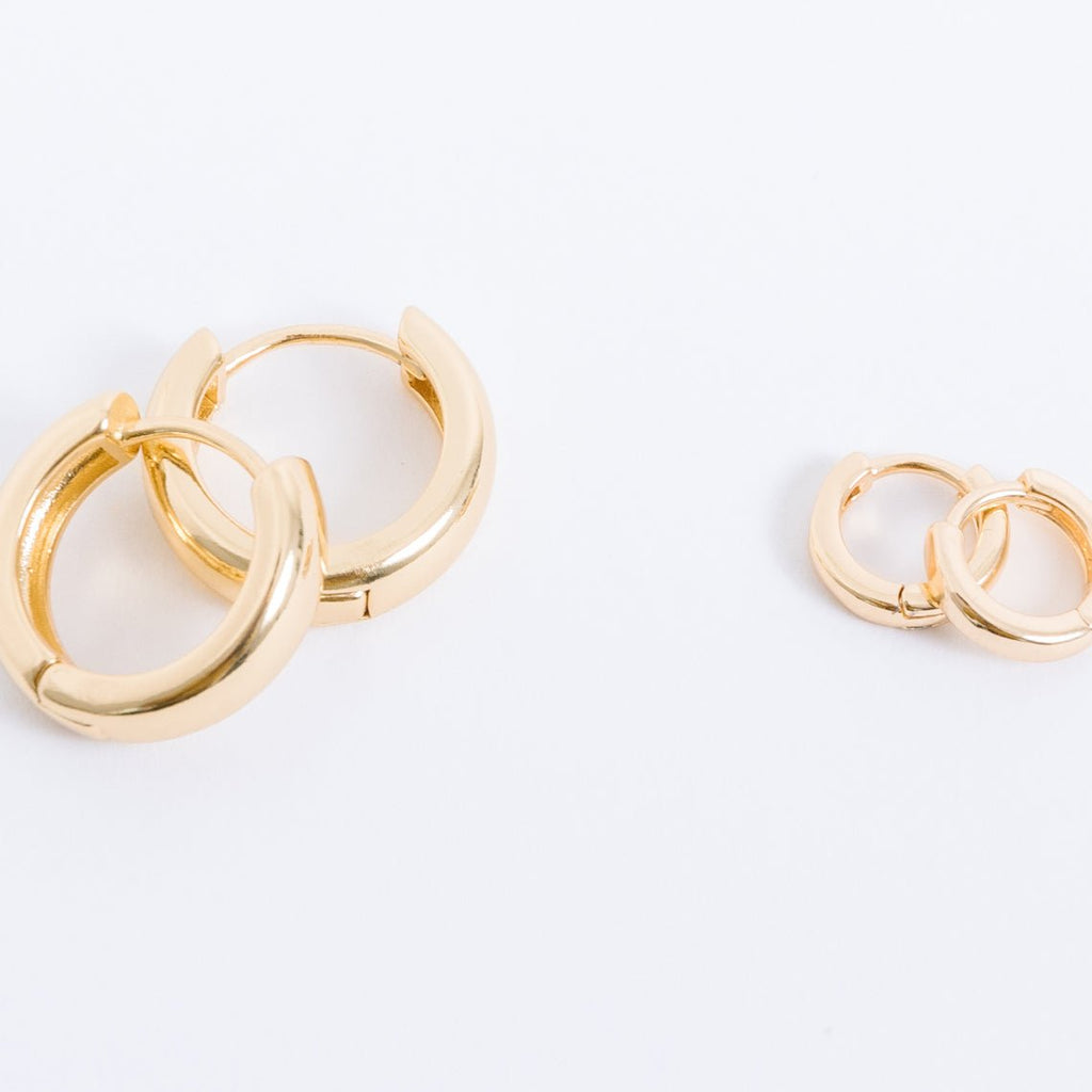 14k gold filled. Safe for sensitive skin. Unique clasp has no post when earrings are closed, allowing for comfortable wear and sleep without having to remove earrings. Available in 9 mm and 16 mm, Hypoallergenic, While gold filled is a strong, sturdy metal for maximum lifespan we don't recommend subjecting the earrings to lots of chemicals, waters, perfumes, etc.